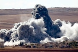 Smoke rises near Kobane