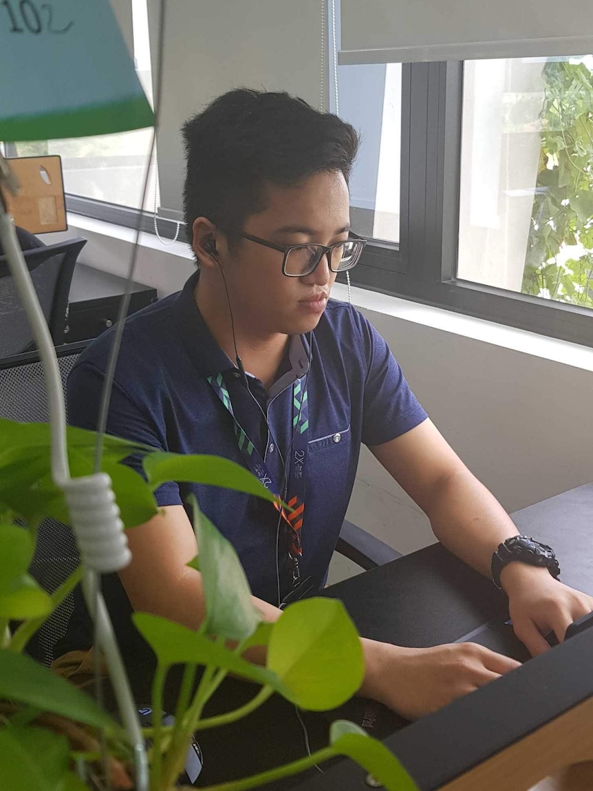 A University of Canberra international undergraduate shows his workplace in Vietnam while awaiting uplift to Australia.