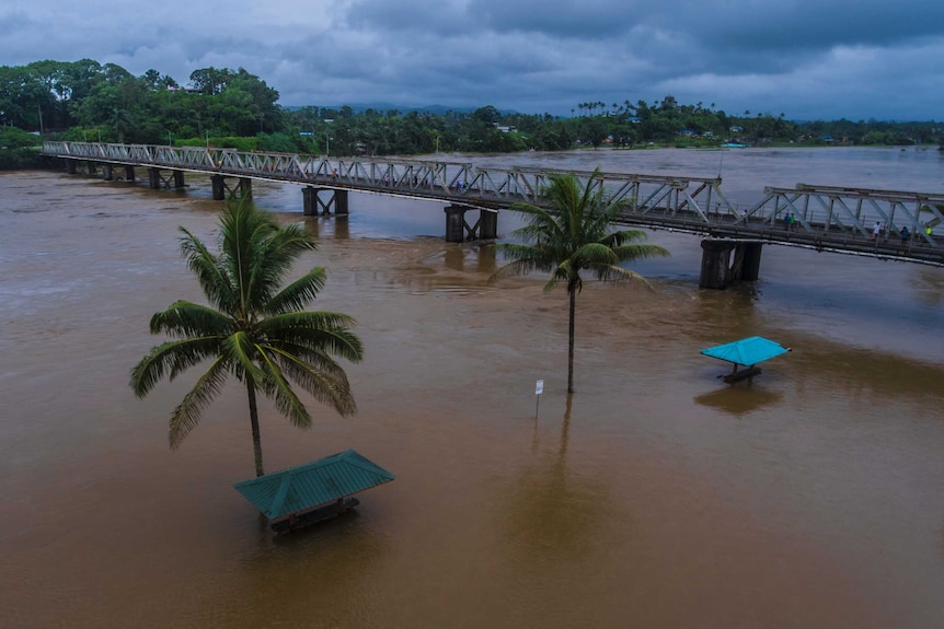 Aerial shot of a river that has burst its banks in Fiji.