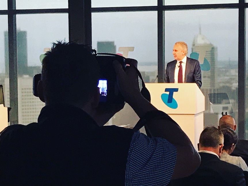 Telstra chief executive Andy Penn addressing a news conference