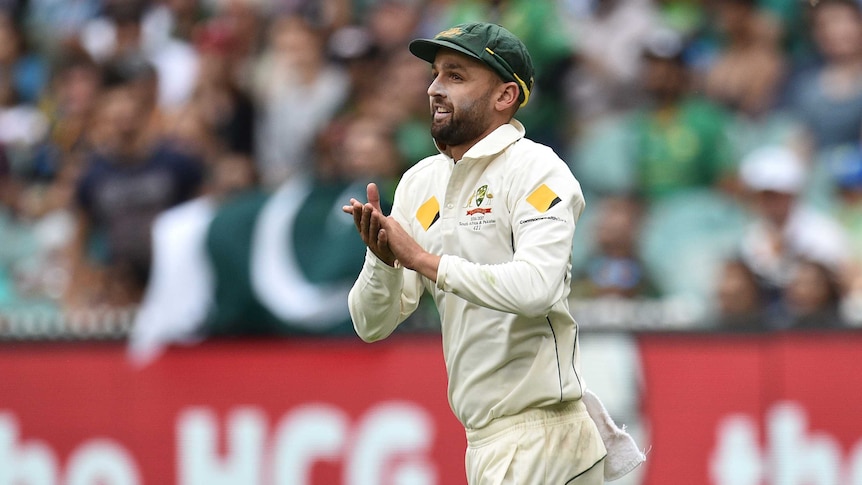 Australia's Nathan Lyon acknowledges the MCG crowd on day one of the second Test with Pakistan.