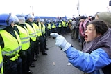 A protester shouts at police officers in Copenhagen