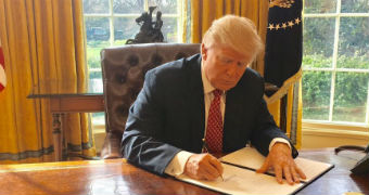 Donald Trump signs new travel ban.