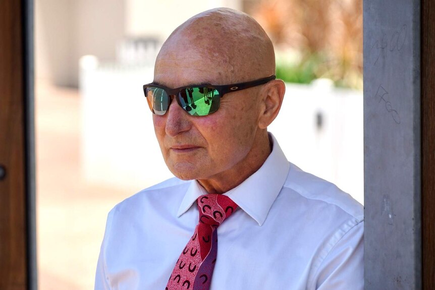 A photo of Northern Territory Chief Officer Hugh Heggie entering a courthouse in Darwin.