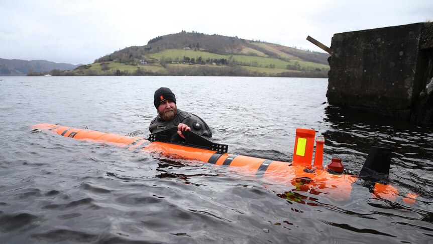 Subsea engineer John Haig launches Munin, an intelligent marine robot, to explore Loch Ness in Scotland.
