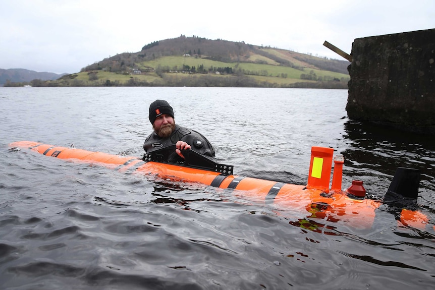 Subsea engineer John Haig launches Munin, an intelligent marine robot, to explore Loch Ness in Scotland.