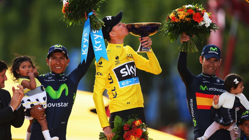 Chris Froome celebrates Tour de France win next to Nairo Quintana (L) and Alejandro Valverde (R).