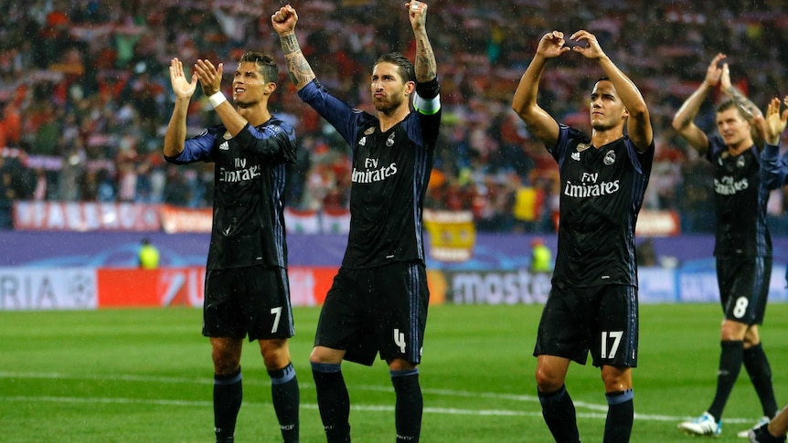 Real Madrid's Cristiano Ronaldo (L) and Sergio Ramos (C) celebrate a win over Atletico Madrid.