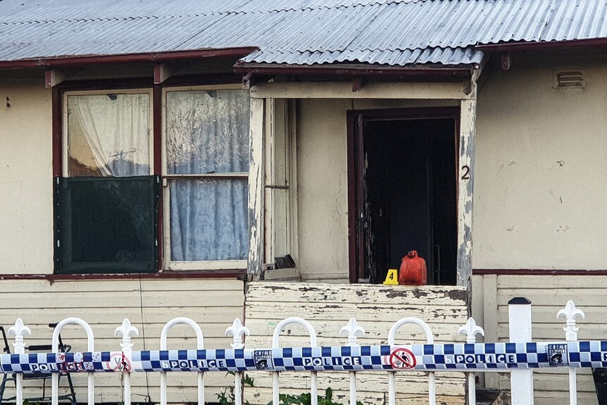 A fuel container marked as evidence at the scene of a house fire in Wellington in the NSW  Central West.