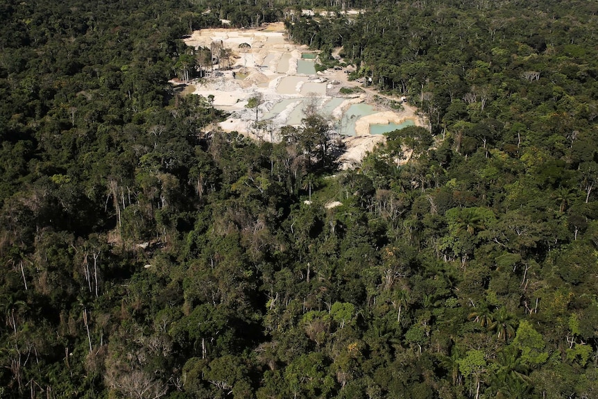 An aerial photo shows illegal wildcat gold mine located on an area of deforested Amazon rainforest.