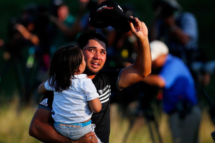 An emotional Jason Day with son Dash after winning the PGA Championship.