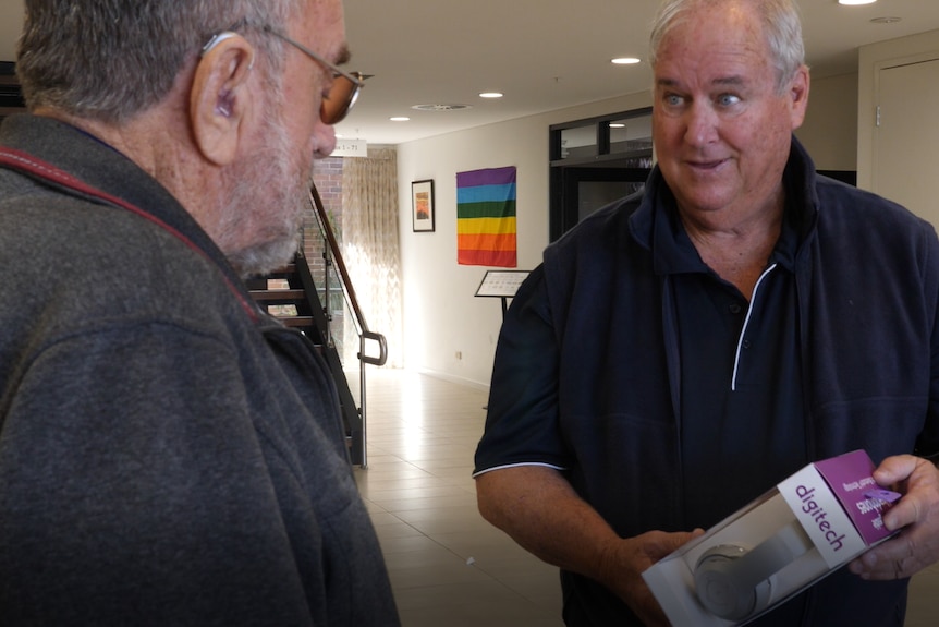 Ken and Geoff Wood look at dementia headset