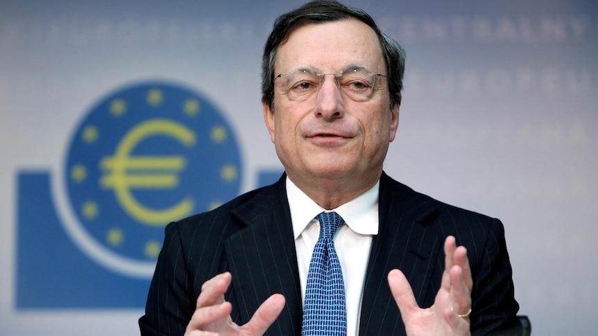 Mario Draghi speaks at a press conference.