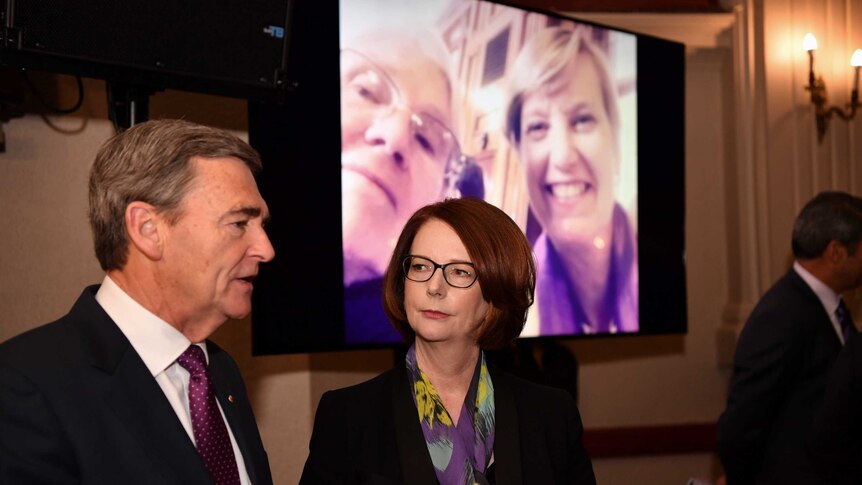 Former Victorian premier John Brumby and former prime minister Julia Gillard at the memorial service for Fiona Richardson.