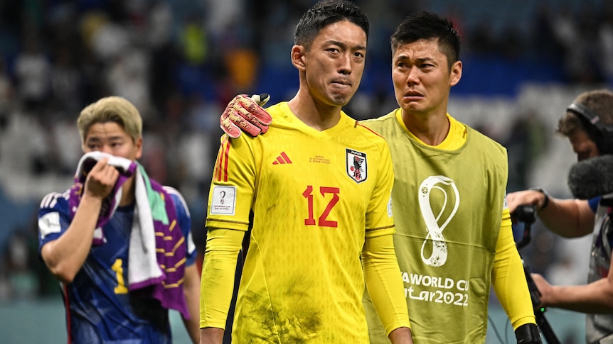 Japan's Shuichi Gonda and Eiji Kawashima look dejected after a penalty shootout.