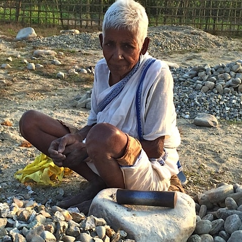 A rock breaker stops her work momentarily