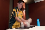 13-year-old Jaydyn Coggins practices his sports stacking.