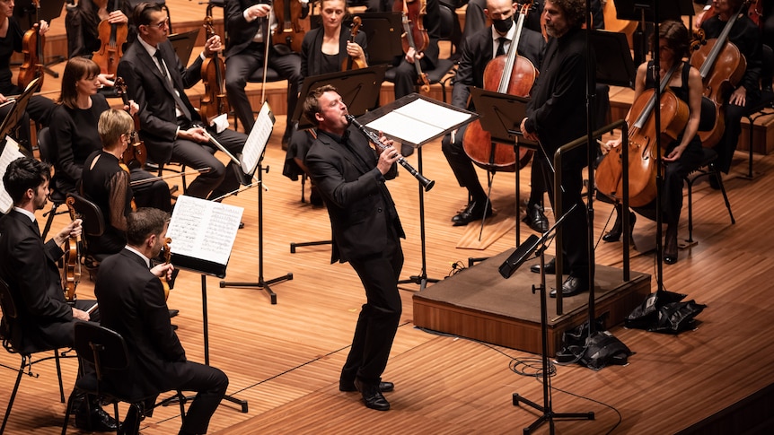 Clarinettist James Bourke on stage with the Sydney Symphony Orchestra