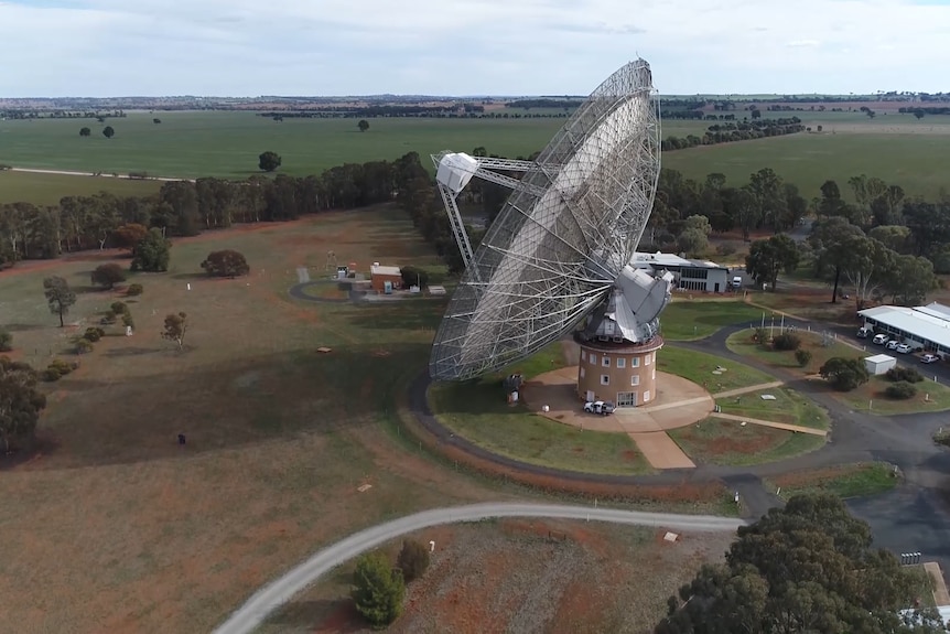 An aerial colour shot of the Parkes dish surrounded by green paddocks.