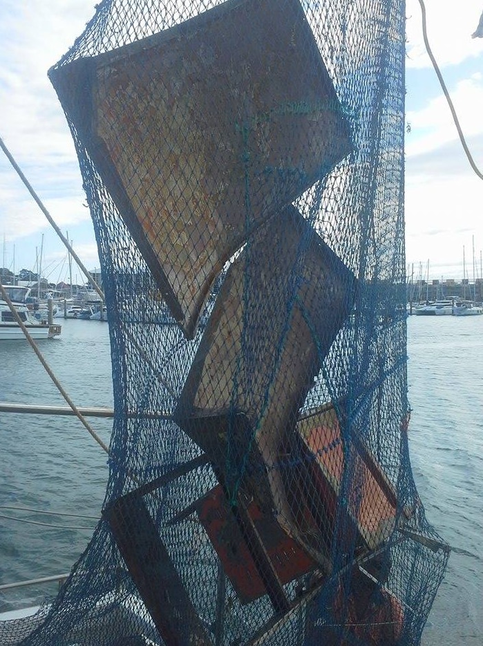 Various pieces of steel or metal in a prawn trawl net