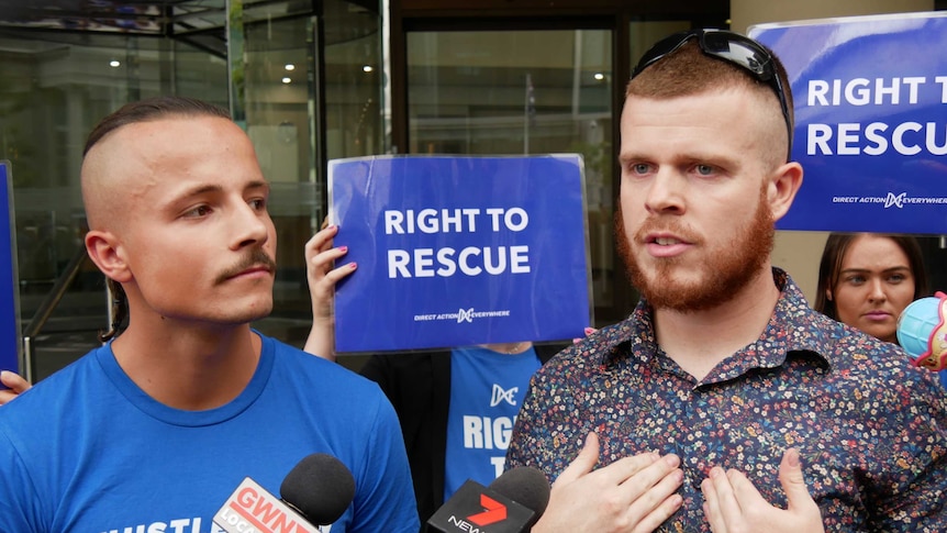 James Warden and co-accused Arkadiusz Swiebodzinski stand in front of media outside of the Perth Magistrates' Court.