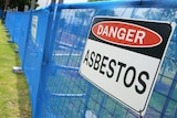Fence with a danger asbestos sign at the Rozelle Parklands as the clean up continues