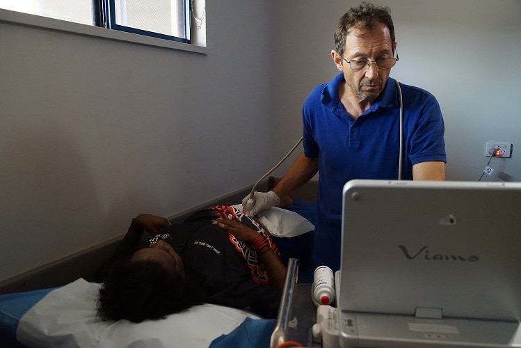 Sonographer Dimi Lupaleasa scans a patient.