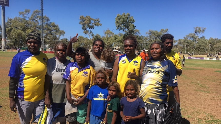 Laramba players and community members celebrate a fifth Community Cup win
