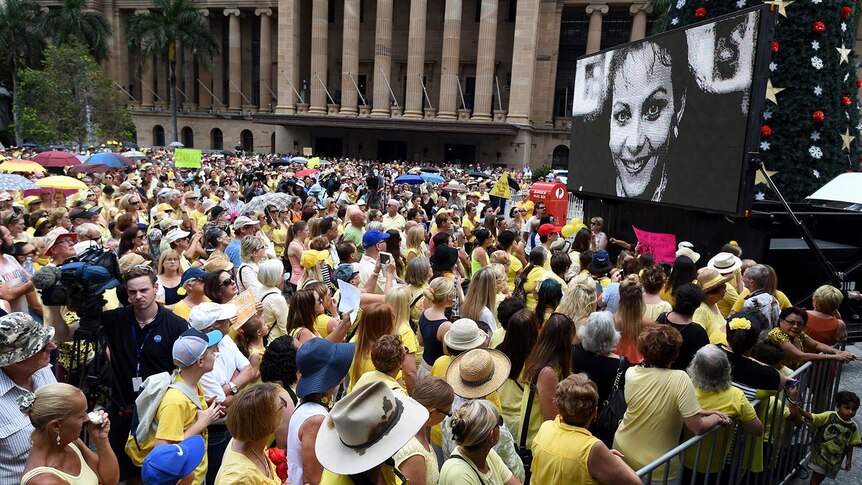 An image of Allison Baden-Clay projected on a screen at a rally in Brisbane