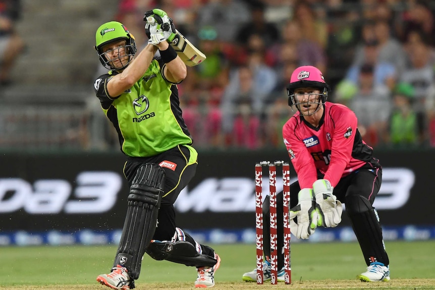 Shane Watson plays a big drive against the Sixers.