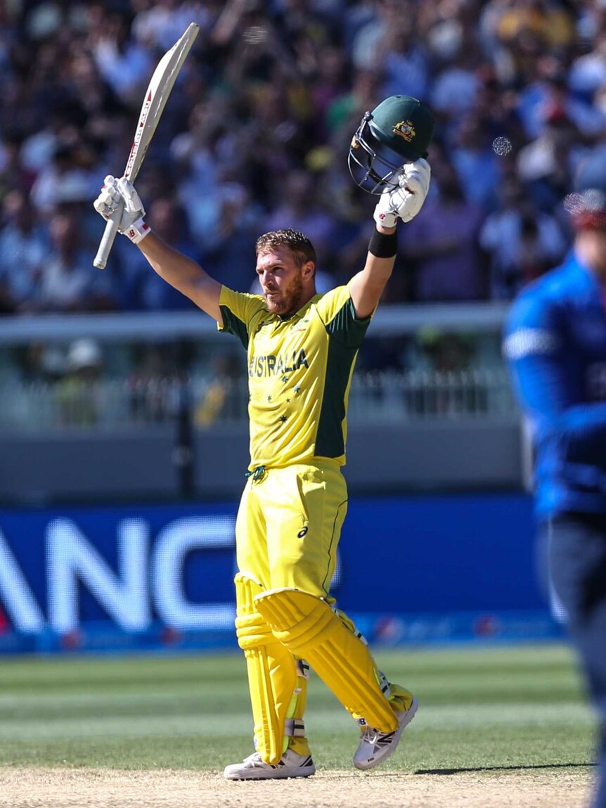 Aaron Finch brings up his century against England