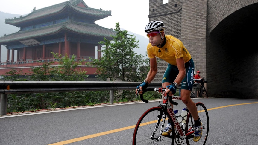 Cadel Evans rides through a gate of The Great Wall ahead of the 2008 Beijing Olympics.