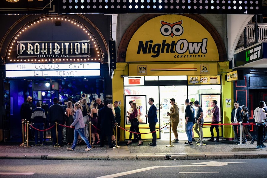 A large queue of people waiting to get into a Brisbane nightclub