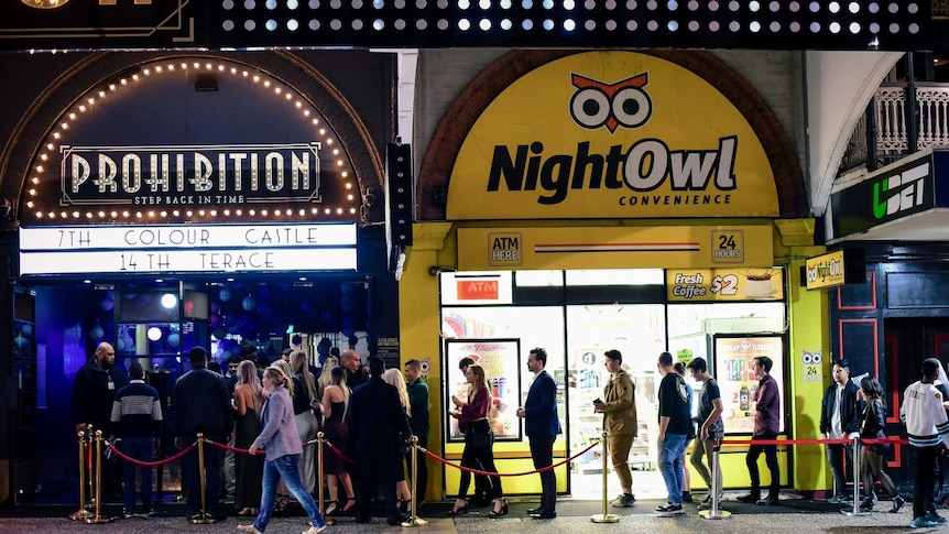 A large queue of people waiting to get into a Brisbane nightclub