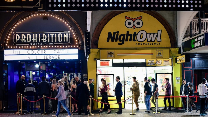 A large queue of people waiting to get into a Brisbane nightclub in Fortitude Valley.