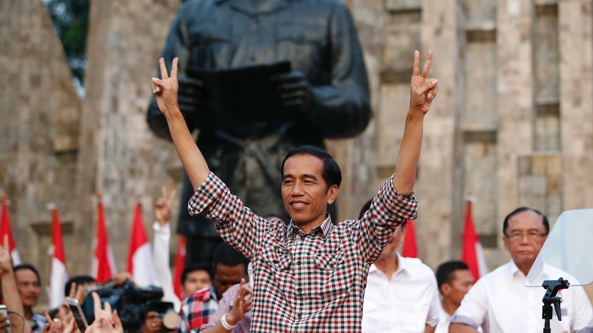 Joko 'Jokowi' Widodo gestures during rally