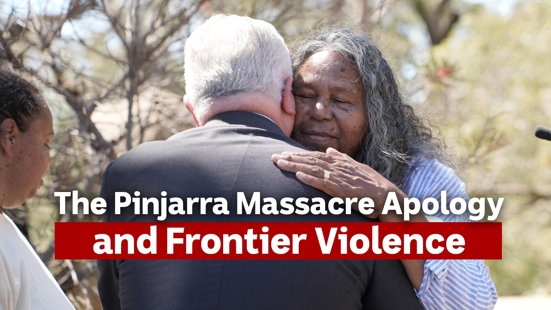 An traditional land owner embraces the Governor General in appreciation.