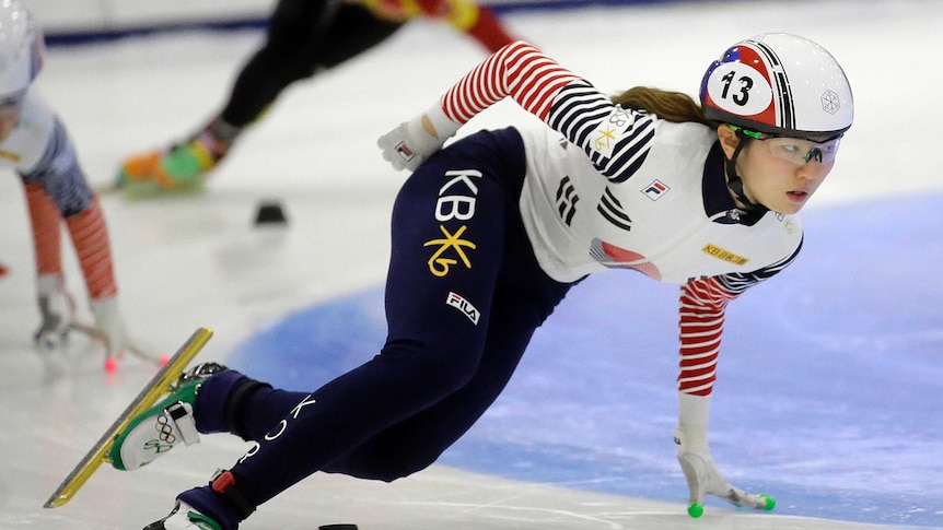 South Korean Olympic speedskater Shim Suk-hee  is competing on ice during a competition