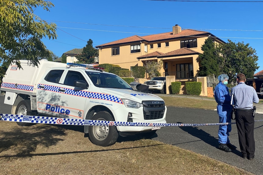 Police outside the Kefu family house after a violent home invasion