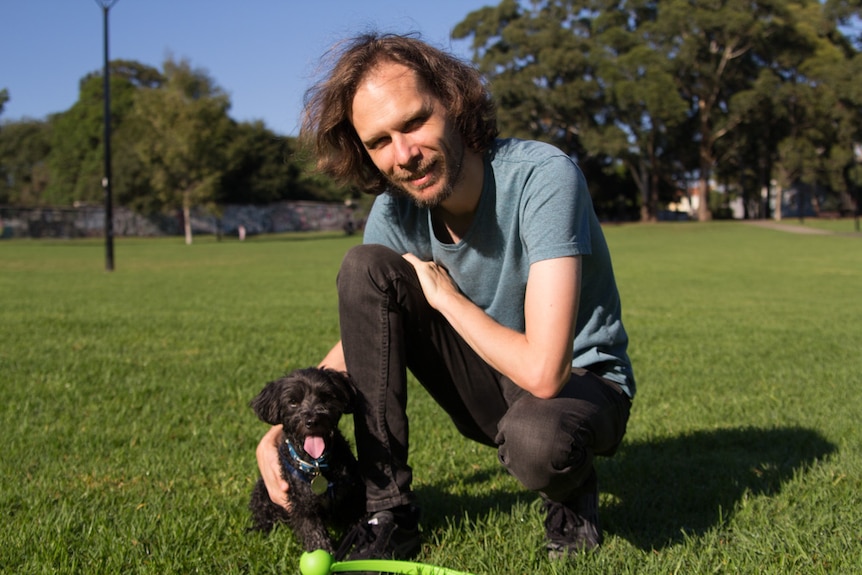 Dog owner Ross Anderson with Tuxedo