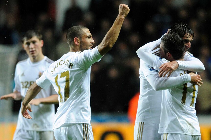 Chelsea held ... Swansea celebrates Pablo Hernandez's (R) last-minute equaliser.