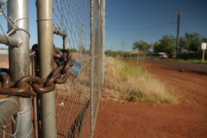 A locked property boundary gate