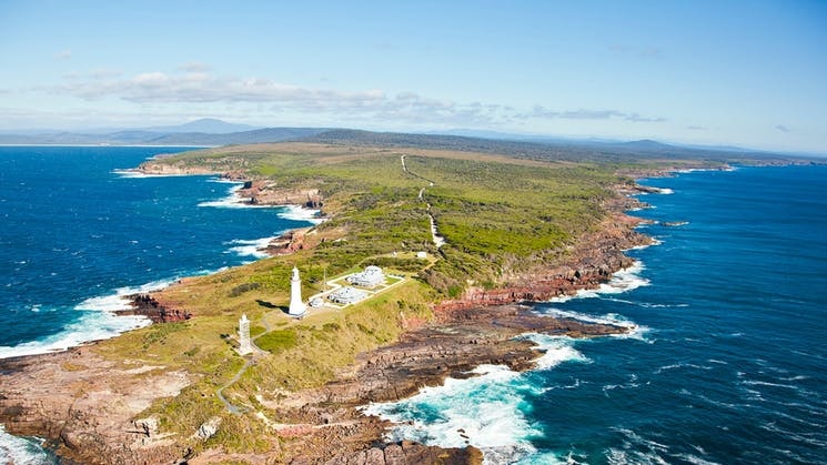 A drone image shows Green Cape Lighthouse and Ben Boyd National Park