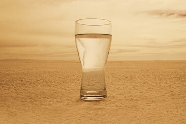 File photo: Glass of water in barren landscape (Getty Creative Images)