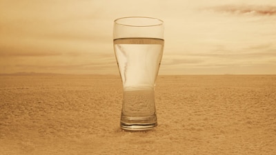 File photo: Glass of water in barren landscape (Getty Creative Images)