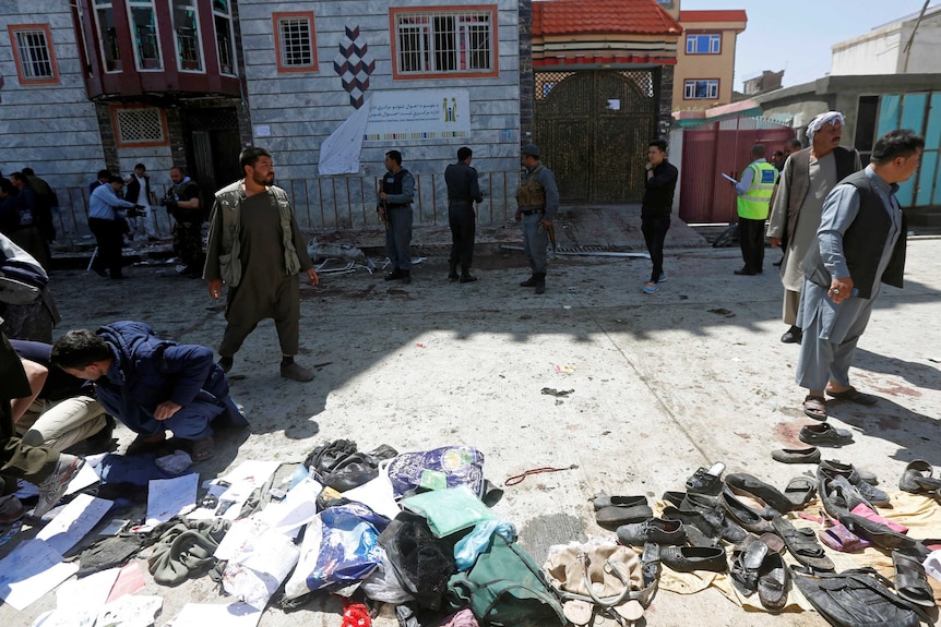 Clothes and sandals are seen at the site of a suicide bomb attack in Kabul.