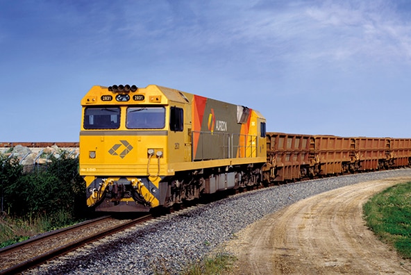 An Aurizon coal train as it passes through the countryside.
