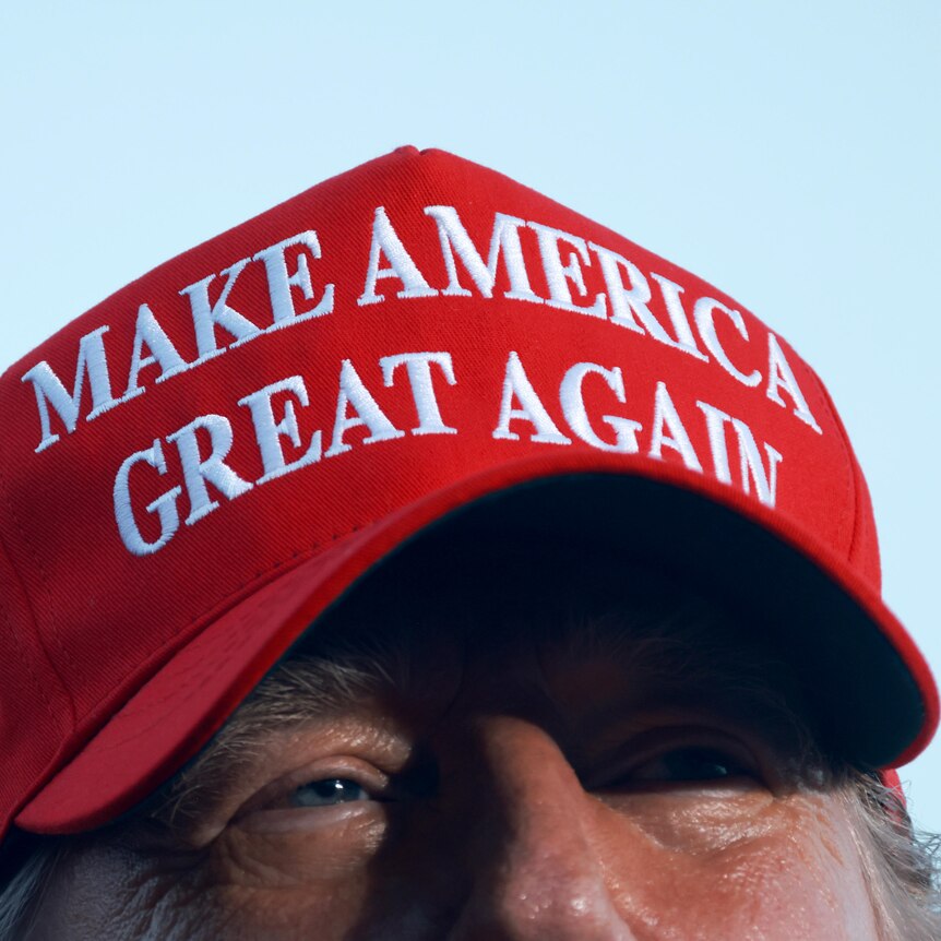 Trump in MAGA hat at Rally 