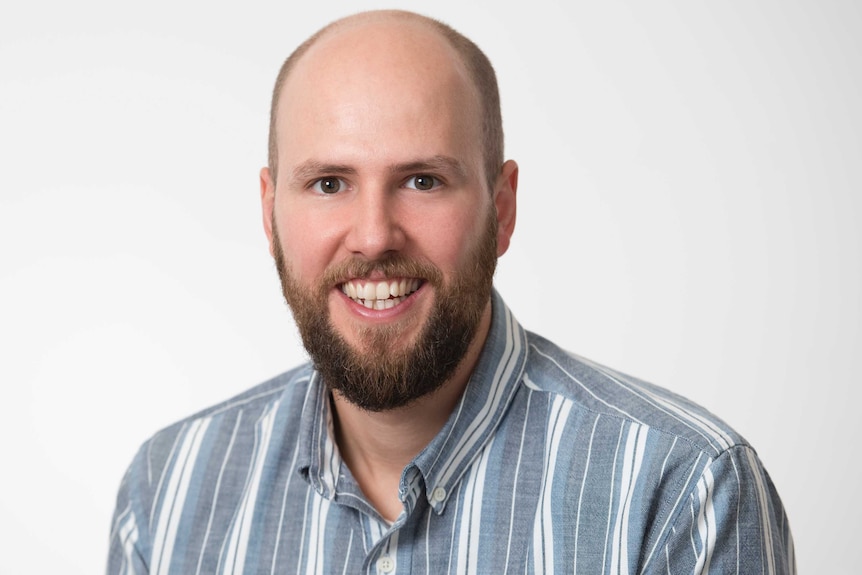 A man in a striped shirt.