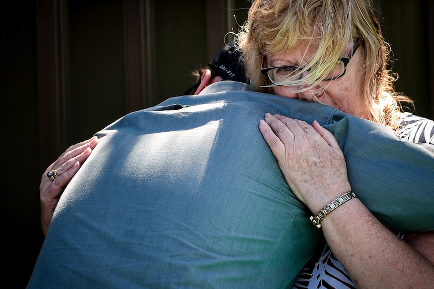 Clinton hugging his mother Vicki Walker
